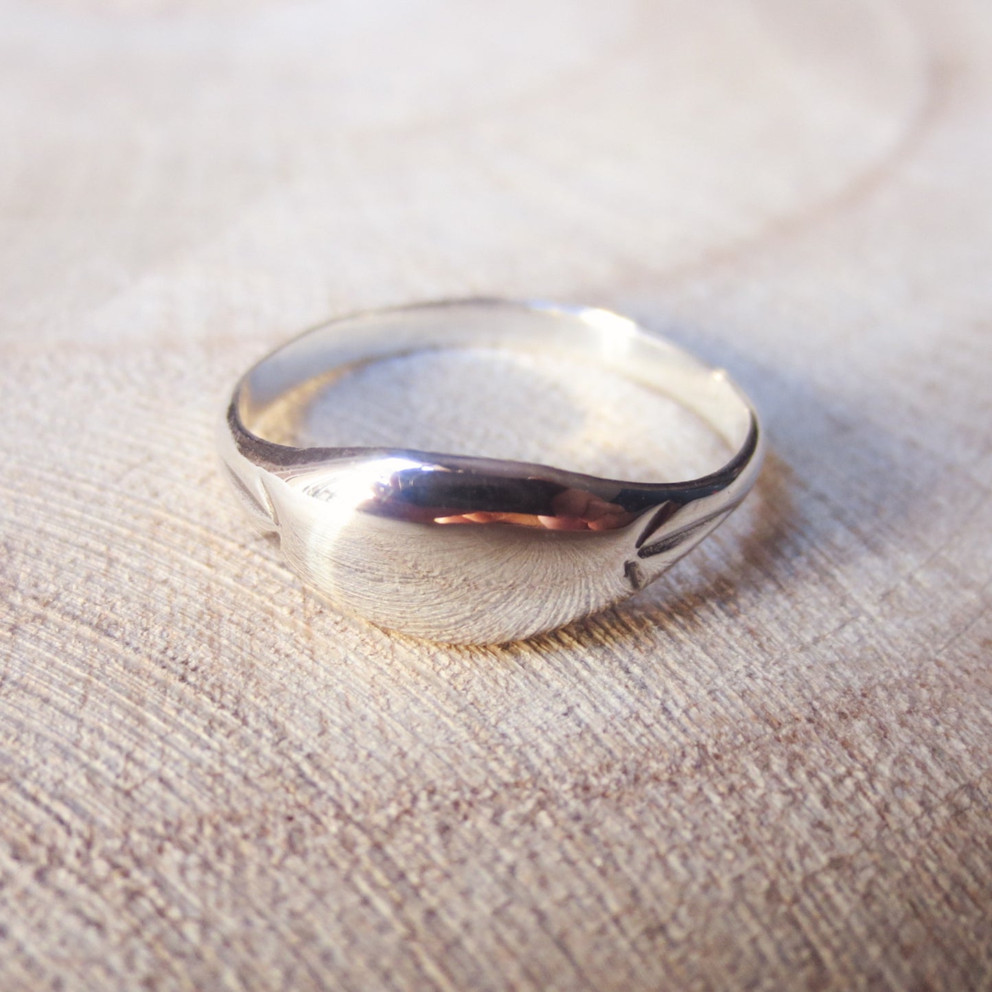 Reunite Signet Ring | smooth low dome signet ring with starburst engravings