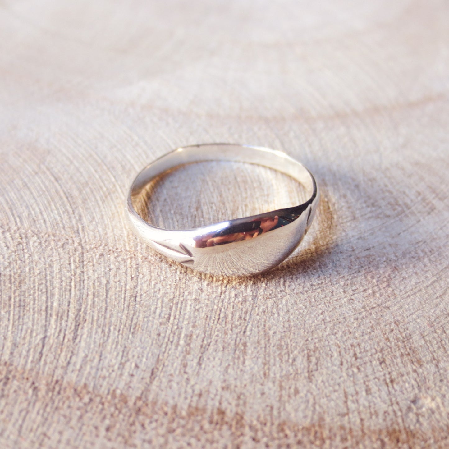 Reunite Signet Ring | smooth low dome signet ring with starburst engravings